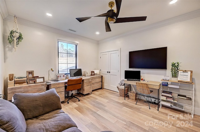 office space featuring light wood-type flooring, ceiling fan, and crown molding