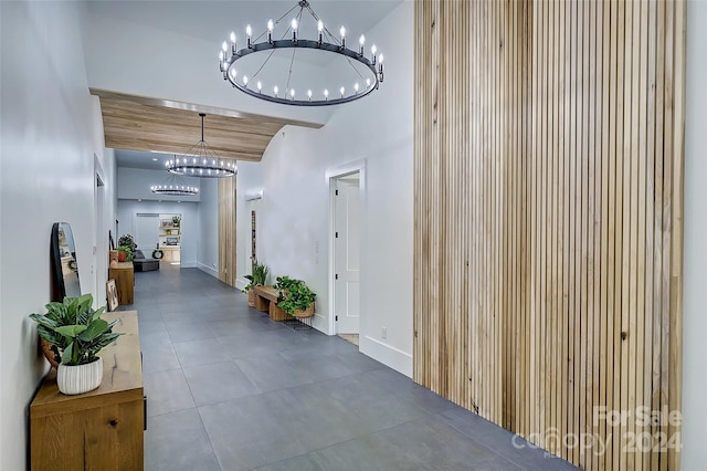 hallway with a chandelier