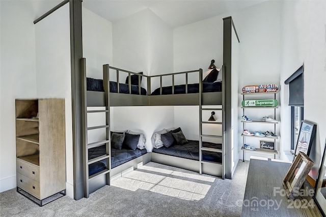 bedroom featuring light carpet