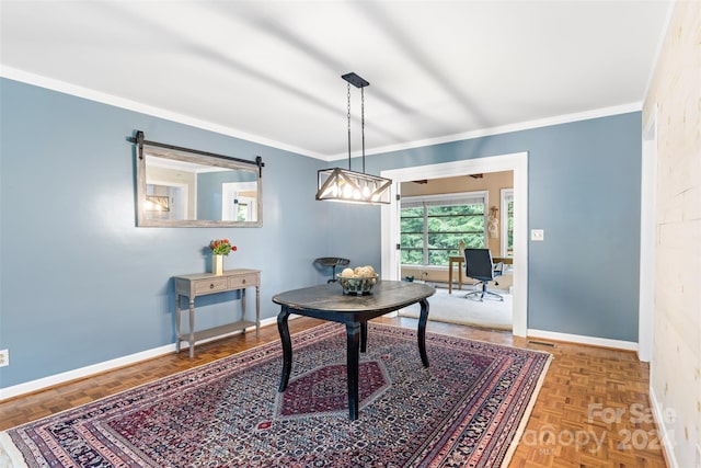 dining area with parquet floors and crown molding