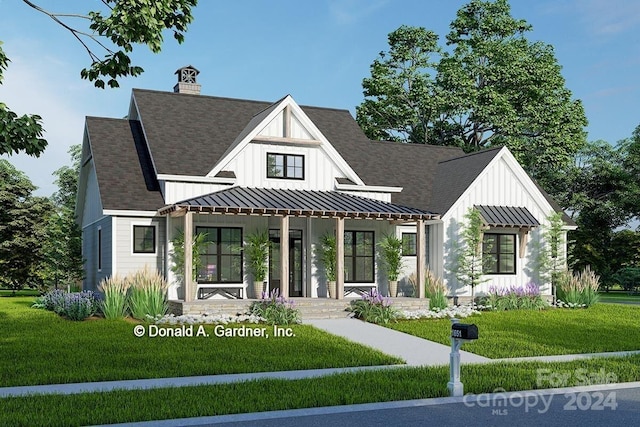 view of front of home featuring a front lawn and covered porch