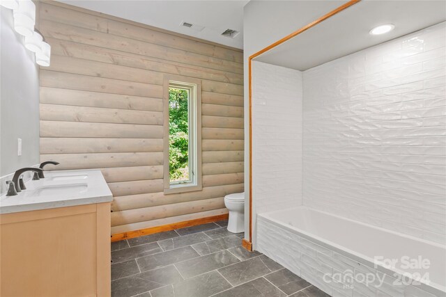 bathroom with a tub to relax in, log walls, vanity, and toilet