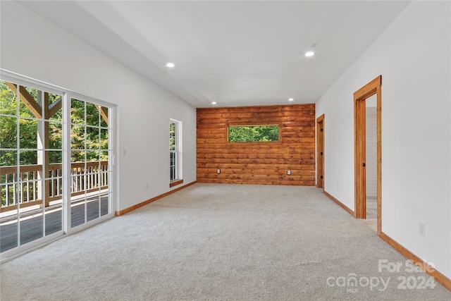 unfurnished living room with light carpet