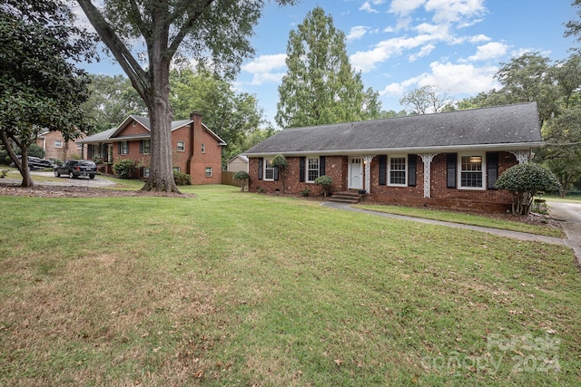 ranch-style home with a front yard