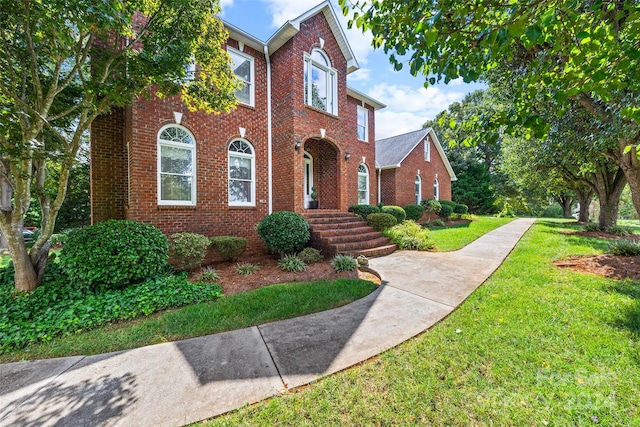 view of front of home with a front lawn