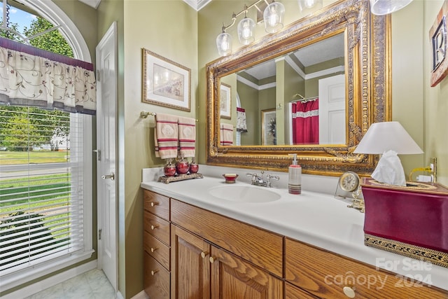 bathroom with vanity and crown molding