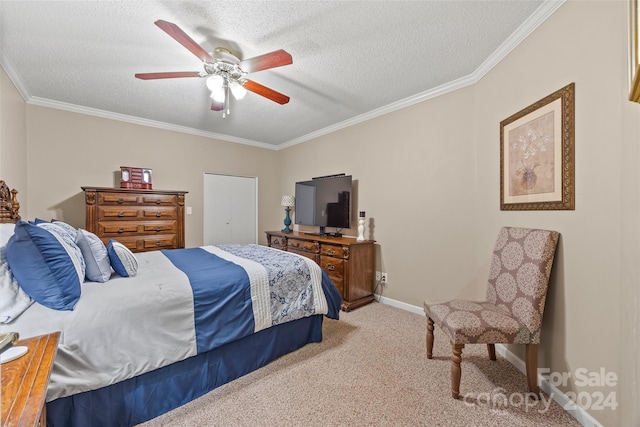 carpeted bedroom with a textured ceiling, crown molding, and ceiling fan