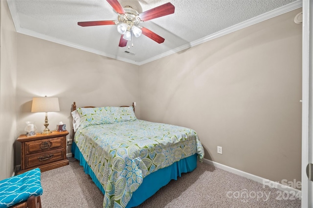 carpeted bedroom with a textured ceiling, crown molding, and ceiling fan