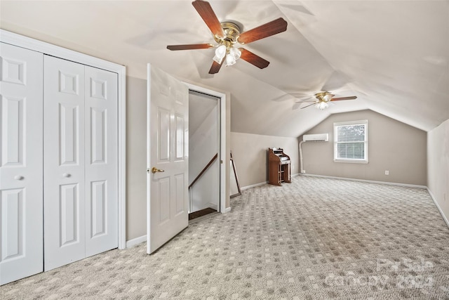 bonus room with lofted ceiling, a wall unit AC, ceiling fan, and light colored carpet