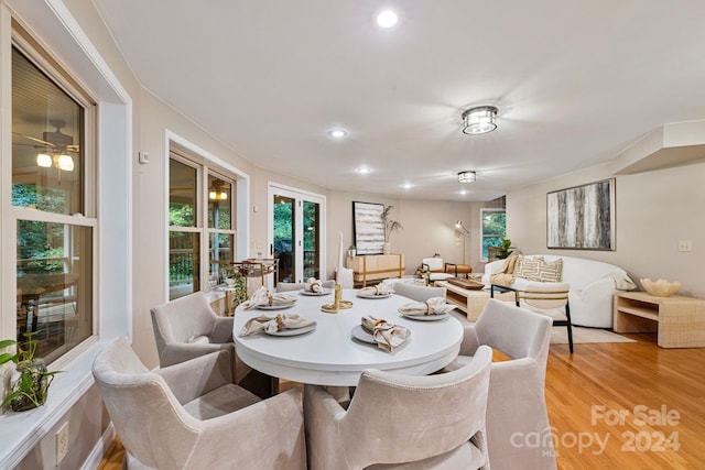 dining space featuring hardwood / wood-style floors and ceiling fan