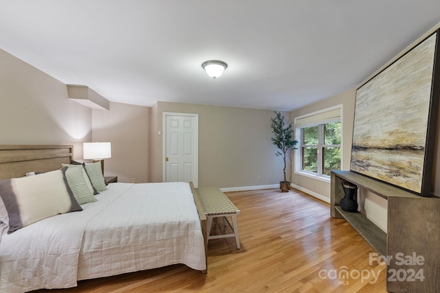 bedroom with light hardwood / wood-style flooring