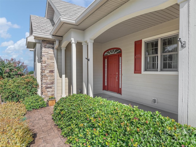 property entrance with covered porch