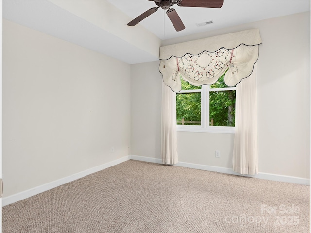 carpeted empty room featuring ceiling fan