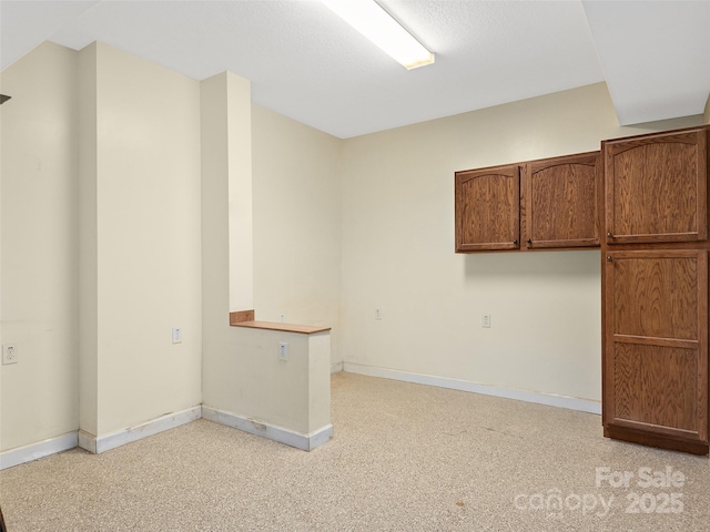 empty room with light colored carpet