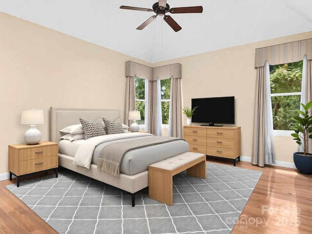 bedroom featuring ceiling fan, lofted ceiling, and dark hardwood / wood-style floors