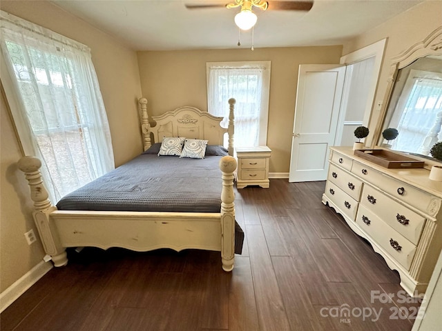 bedroom with ceiling fan and dark hardwood / wood-style flooring