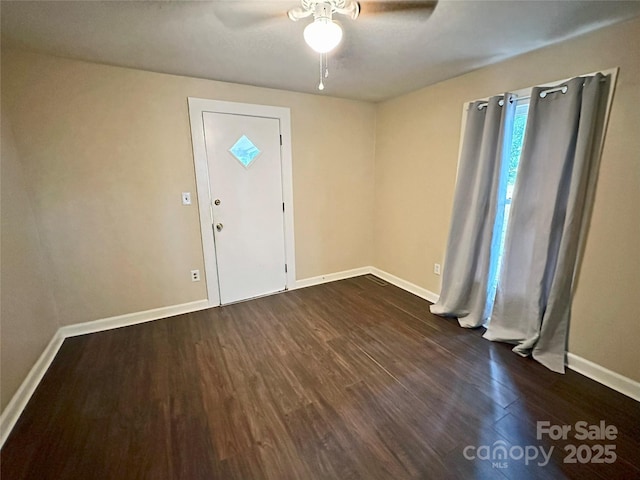 entrance foyer with dark wood-type flooring and ceiling fan