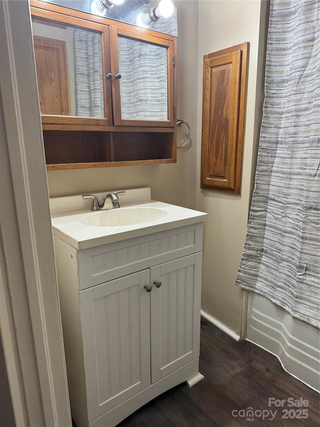 bathroom with vanity, wood-type flooring, and a shower with shower curtain