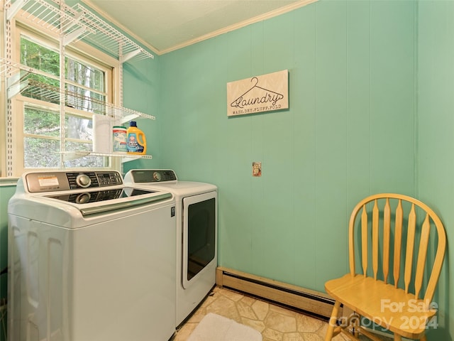 clothes washing area featuring separate washer and dryer, ornamental molding, and a baseboard radiator