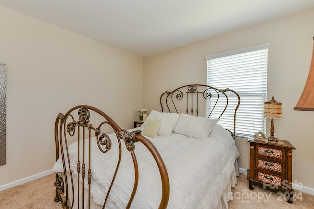 bedroom with light colored carpet