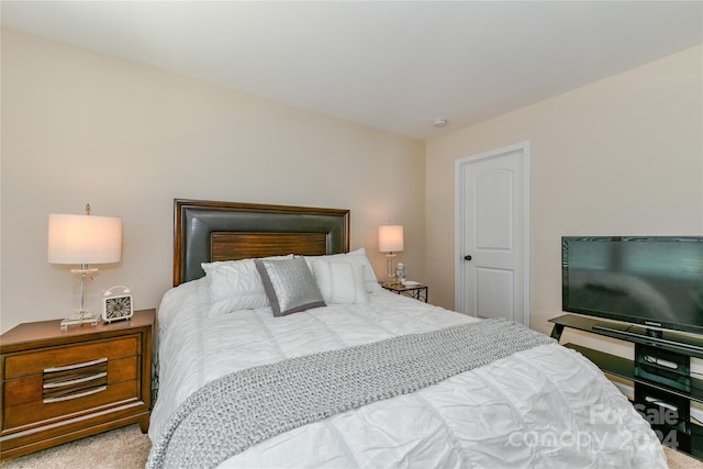 bedroom featuring light carpet