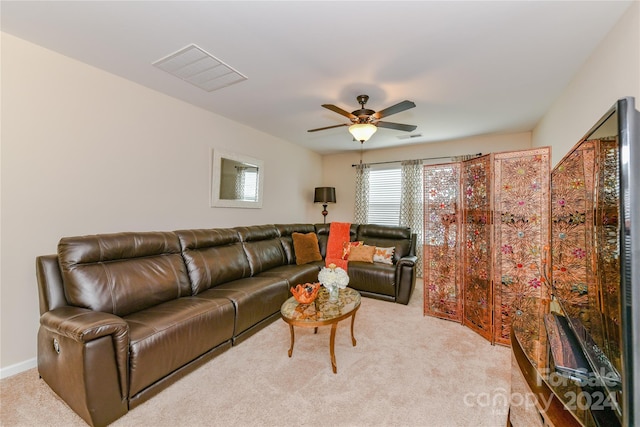 living room with light carpet and ceiling fan