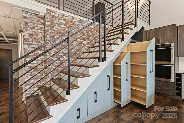 stairway featuring hardwood / wood-style flooring