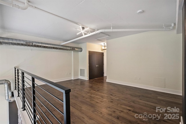 basement with dark wood-type flooring