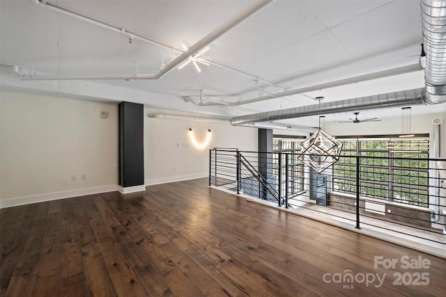 empty room with wood-type flooring and ceiling fan