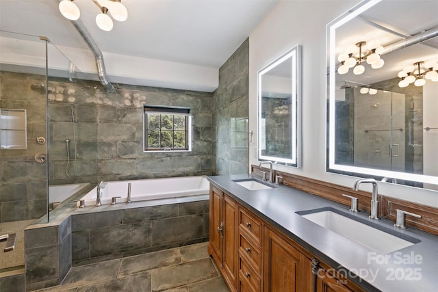 bathroom featuring shower with separate bathtub and vanity