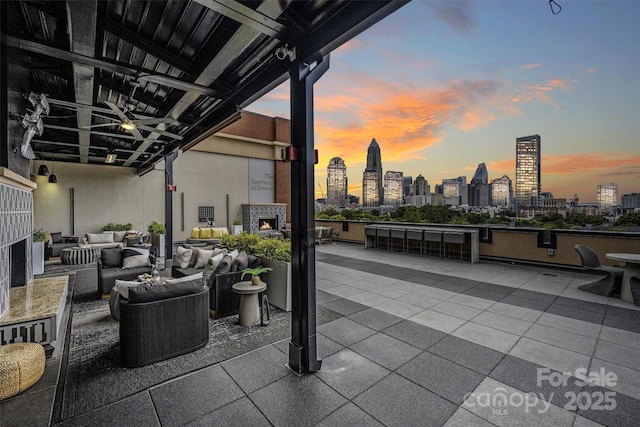 patio terrace at dusk with an outdoor living space