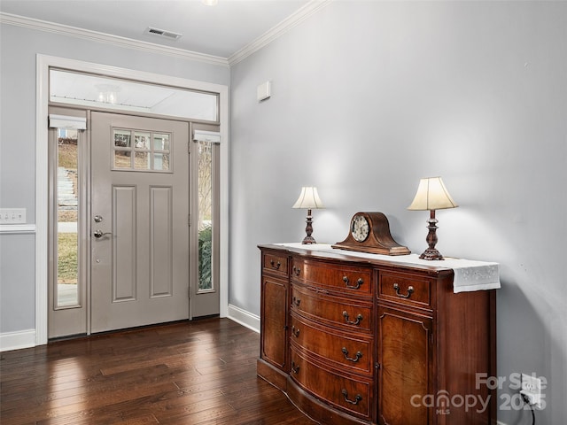 entryway with crown molding, dark hardwood / wood-style floors, and a wealth of natural light