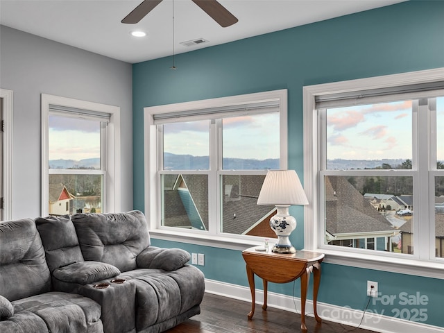 interior space featuring dark hardwood / wood-style flooring and ceiling fan