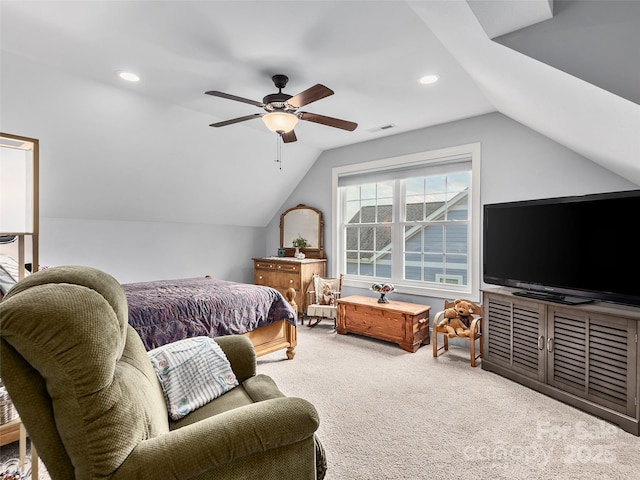 bedroom with lofted ceiling, ceiling fan, and carpet flooring