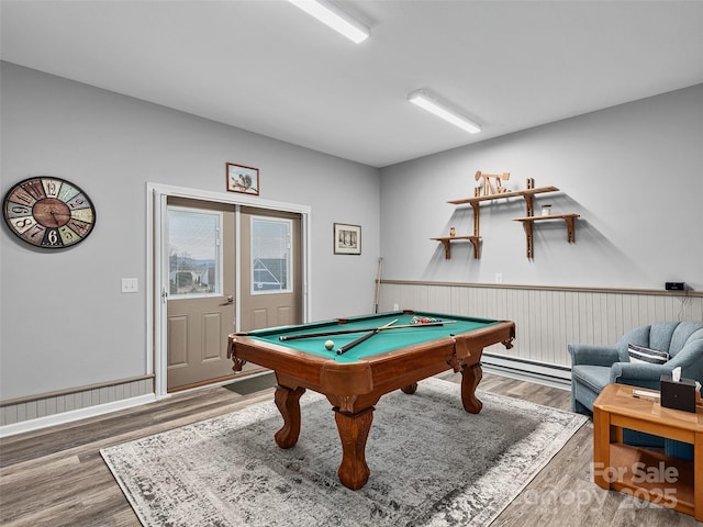 recreation room featuring hardwood / wood-style floors, billiards, and baseboard heating