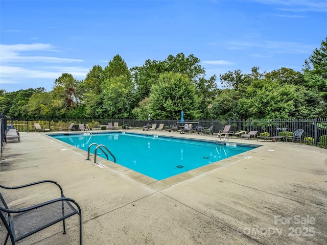 view of pool featuring a patio