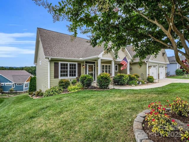 154 N Anvil Ave, Hendersonville, NC 28792 - view of front of property with concrete driveway, a garage, roof with shingles, and a front lawn