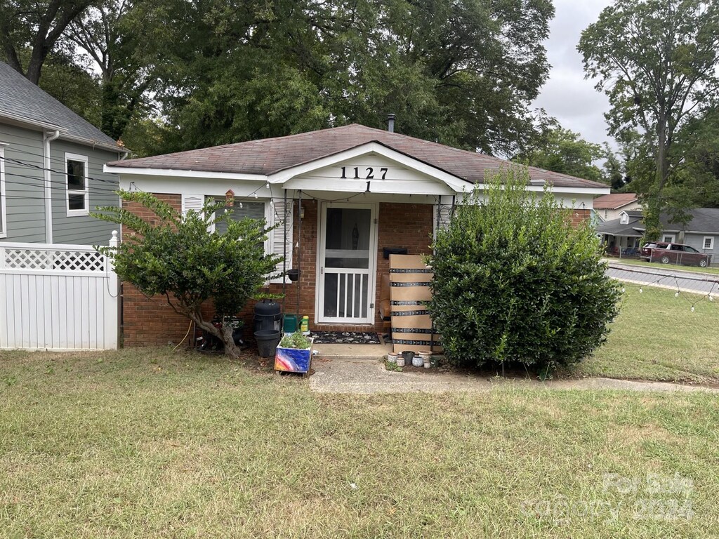 1127 Allen St, Charlotte, NC 28205 - bungalow-style house with brick siding