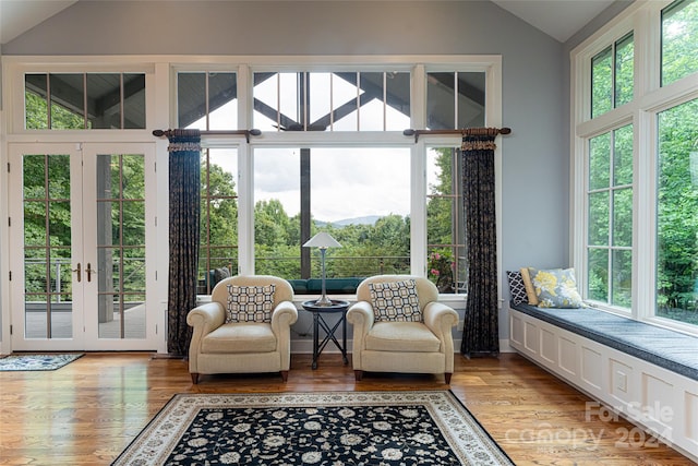 interior space featuring light hardwood / wood-style flooring and vaulted ceiling