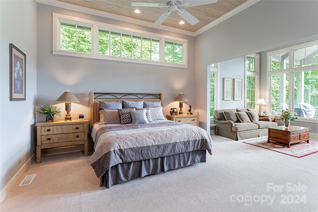 bedroom with multiple windows, a towering ceiling, and ceiling fan