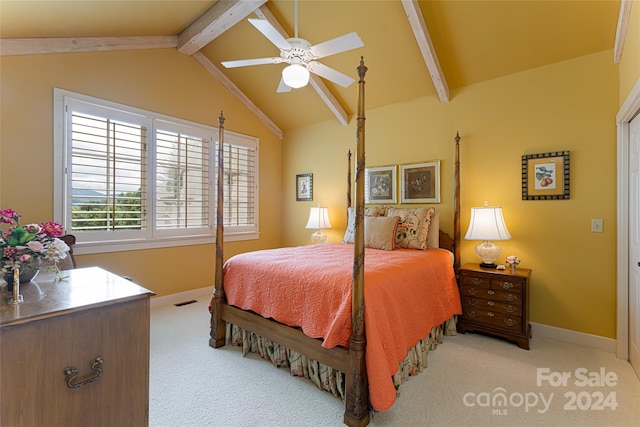 carpeted bedroom with lofted ceiling with beams and ceiling fan