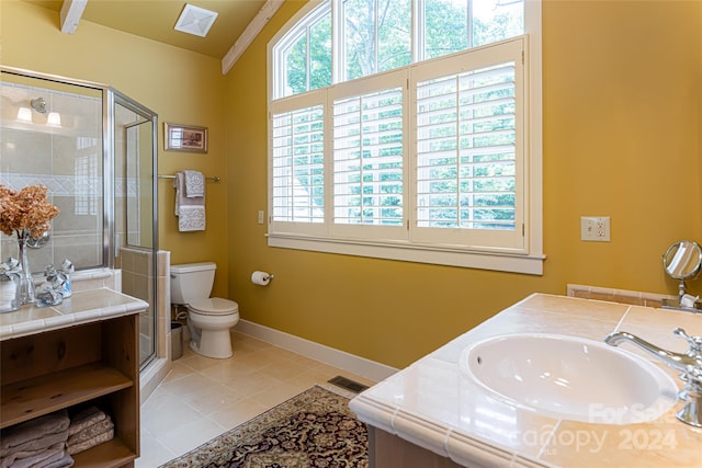 bathroom featuring vanity, toilet, ornamental molding, an enclosed shower, and tile patterned flooring