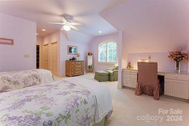 bedroom featuring lofted ceiling, light carpet, and ceiling fan