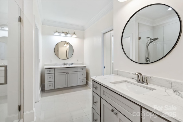 bathroom featuring an enclosed shower, vanity, crown molding, and tile patterned floors