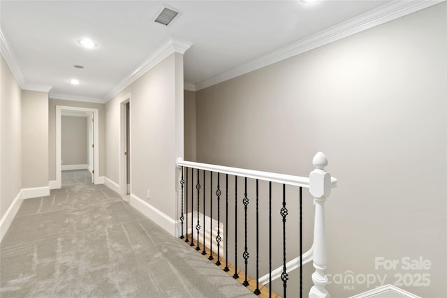 hall with crown molding and carpet flooring