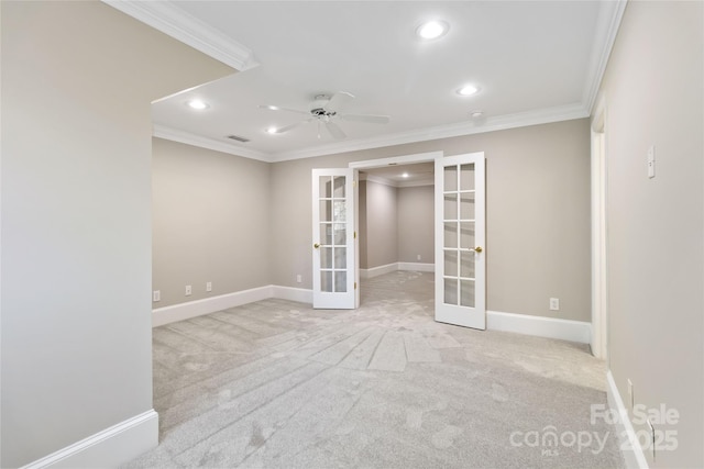 unfurnished room featuring french doors, ceiling fan, ornamental molding, and light carpet