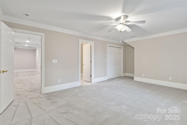 unfurnished bedroom featuring connected bathroom, ornamental molding, light colored carpet, ceiling fan, and a closet