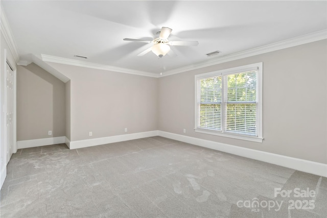 unfurnished room featuring ornamental molding, light carpet, and ceiling fan