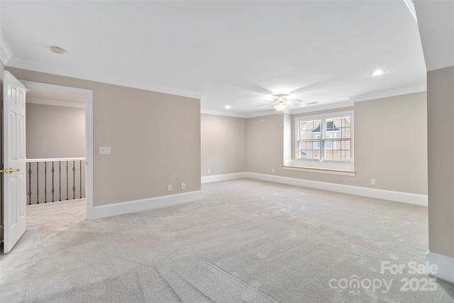 unfurnished room featuring light colored carpet, ornamental molding, and ceiling fan