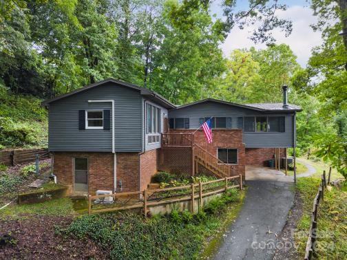 view of front of home featuring a deck and a carport